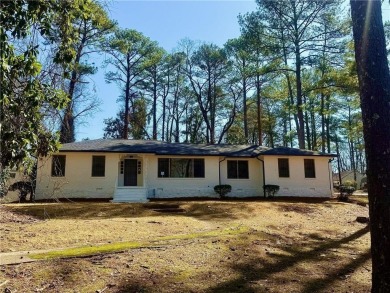 Welcome to this beautifully updated 4-bedroom, 2-bath brick home on Alfred Tup Holmes Golf Course in Georgia - for sale on GolfHomes.com, golf home, golf lot