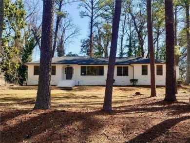 Welcome to this beautifully updated 4-bedroom, 2-bath brick home on Alfred Tup Holmes Golf Course in Georgia - for sale on GolfHomes.com, golf home, golf lot
