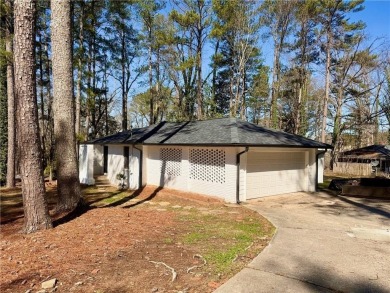 Welcome to this beautifully updated 4-bedroom, 2-bath brick home on Alfred Tup Holmes Golf Course in Georgia - for sale on GolfHomes.com, golf home, golf lot