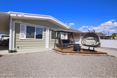 Step inside this mobile home that's been thoughtfully updated on The Refuge Golf and Country Club in Arizona - for sale on GolfHomes.com, golf home, golf lot