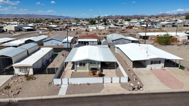 Step inside this mobile home that's been thoughtfully updated on The Refuge Golf and Country Club in Arizona - for sale on GolfHomes.com, golf home, golf lot
