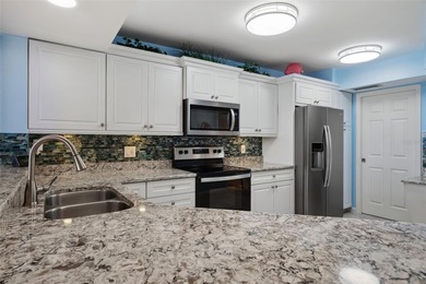 Should I take the convertible or the SUV to the beach today? on Isla Del Sol Yacht and Country Club in Florida - for sale on GolfHomes.com, golf home, golf lot