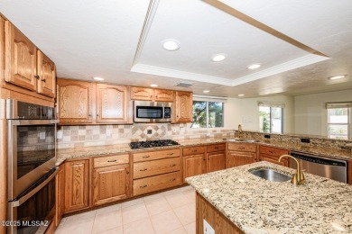 This one has it all!  5 bedrooms, 3 bathrooms, 2 dining areas, 2 on El Conquistador Country Club - Conquistador in Arizona - for sale on GolfHomes.com, golf home, golf lot