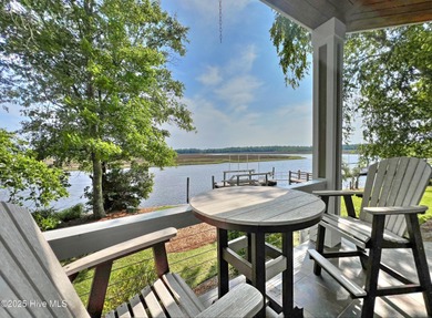 Welcome to this exquisite riverfront property, located in a golf on Carolina National Golf Club in North Carolina - for sale on GolfHomes.com, golf home, golf lot