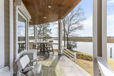 Welcome to this exquisite riverfront property, located in a golf on Carolina National Golf Club in North Carolina - for sale on GolfHomes.com, golf home, golf lot