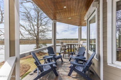 Welcome to this exquisite riverfront property, located in a golf on Carolina National Golf Club in North Carolina - for sale on GolfHomes.com, golf home, golf lot