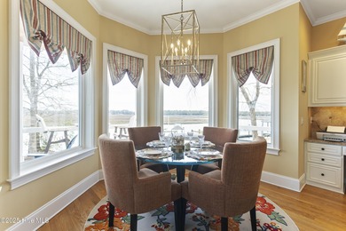 Welcome to this exquisite riverfront property, located in a golf on Carolina National Golf Club in North Carolina - for sale on GolfHomes.com, golf home, golf lot