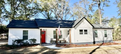 This beautifully remodeled home is truly move-in ready, offering on Wildwood Country Club in Florida - for sale on GolfHomes.com, golf home, golf lot