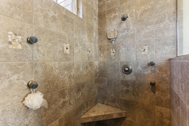 Welcome to this exquisite riverfront property, located in a golf on Carolina National Golf Club in North Carolina - for sale on GolfHomes.com, golf home, golf lot