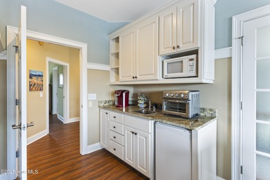 Welcome to this exquisite riverfront property, located in a golf on Carolina National Golf Club in North Carolina - for sale on GolfHomes.com, golf home, golf lot