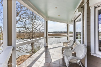 Welcome to this exquisite riverfront property, located in a golf on Carolina National Golf Club in North Carolina - for sale on GolfHomes.com, golf home, golf lot