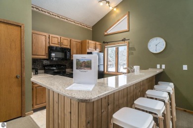 Experience the best of resort living in this fully furnished on Schuss Mountain Golf Club in Michigan - for sale on GolfHomes.com, golf home, golf lot