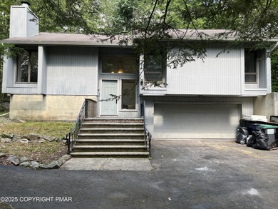 Located among a golf course, fishing spots and pools, tennis on Pocono Farms Country Club in Pennsylvania - for sale on GolfHomes.com, golf home, golf lot