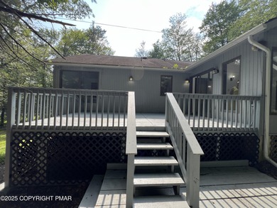 Located among a golf course, fishing spots and pools, tennis on Pocono Farms Country Club in Pennsylvania - for sale on GolfHomes.com, golf home, golf lot