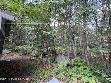 Located among a golf course, fishing spots and pools, tennis on Pocono Farms Country Club in Pennsylvania - for sale on GolfHomes.com, golf home, golf lot