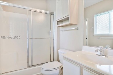This custom Charleston model has it all--end unit with abundant on Okatie Creek Golf Club in South Carolina - for sale on GolfHomes.com, golf home, golf lot