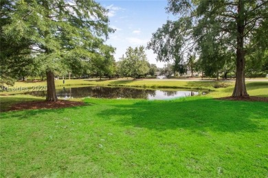 This custom Charleston model has it all--end unit with abundant on Okatie Creek Golf Club in South Carolina - for sale on GolfHomes.com, golf home, golf lot