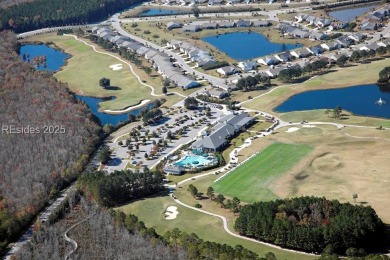 This custom Charleston model has it all--end unit with abundant on Okatie Creek Golf Club in South Carolina - for sale on GolfHomes.com, golf home, golf lot