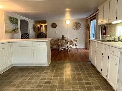 Amazing 3 bedroom, 2 full-bath double-wide could be yours in on Wedgewood Golf Club in Florida - for sale on GolfHomes.com, golf home, golf lot