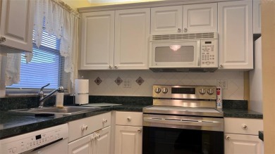 Golf, indoor and outdoor pools, tennis, movies and pickleball on Sunrise Lakes Phase III in Florida - for sale on GolfHomes.com, golf home, golf lot
