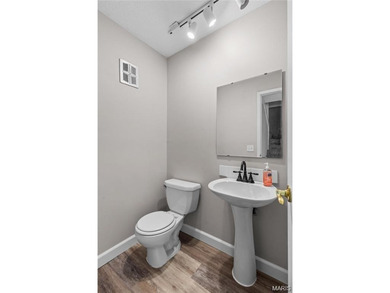 Live the lake life! This nicely updated 3 bedroom, 2.5 bathroom on Lake Saint Louis Par 3 in Missouri - for sale on GolfHomes.com, golf home, golf lot