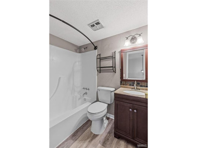 Live the lake life! This nicely updated 3 bedroom, 2.5 bathroom on Lake Saint Louis Par 3 in Missouri - for sale on GolfHomes.com, golf home, golf lot