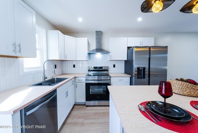 WATERFRONT DRIVE MODERN RENOVATED CONTEMPORARY RANCH Lake Views on Pocono Farms Country Club in Pennsylvania - for sale on GolfHomes.com, golf home, golf lot