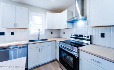 WATERFRONT DRIVE MODERN RENOVATED CONTEMPORARY RANCH Lake Views on Pocono Farms Country Club in Pennsylvania - for sale on GolfHomes.com, golf home, golf lot