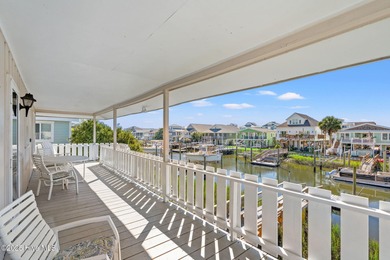 Charming Beach Cottage on Canal Lot with Boat Dock This is a on Sea Trail Golf Resort in North Carolina - for sale on GolfHomes.com, golf home, golf lot