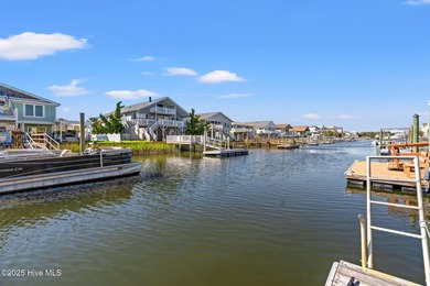 Charming Beach Cottage on Canal Lot with Boat Dock This is a on Sea Trail Golf Resort in North Carolina - for sale on GolfHomes.com, golf home, golf lot