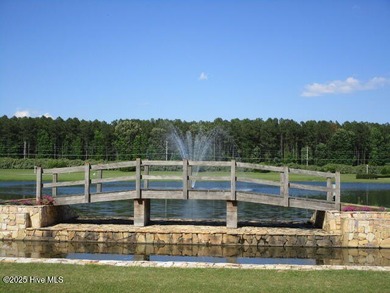 This .44 acre lot located on the golf course with trees in on Sound Golf Links at Albemarle Plantation in North Carolina - for sale on GolfHomes.com, golf home, golf lot