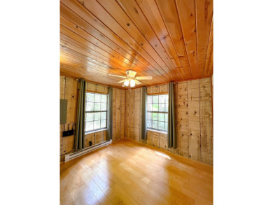 Discover this updated cabin retreat steps from golfing, fishing on El Valle Escondido Golf Course in New Mexico - for sale on GolfHomes.com, golf home, golf lot