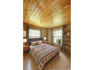 Discover this updated cabin retreat steps from golfing, fishing on El Valle Escondido Golf Course in New Mexico - for sale on GolfHomes.com, golf home, golf lot