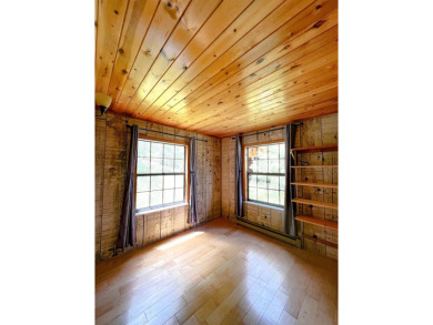 Discover this updated cabin retreat steps from golfing, fishing on El Valle Escondido Golf Course in New Mexico - for sale on GolfHomes.com, golf home, golf lot