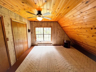 Discover this updated cabin retreat steps from golfing, fishing on El Valle Escondido Golf Course in New Mexico - for sale on GolfHomes.com, golf home, golf lot