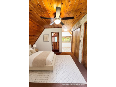 Discover this updated cabin retreat steps from golfing, fishing on El Valle Escondido Golf Course in New Mexico - for sale on GolfHomes.com, golf home, golf lot