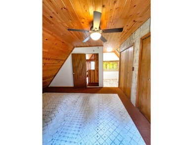 Discover this updated cabin retreat steps from golfing, fishing on El Valle Escondido Golf Course in New Mexico - for sale on GolfHomes.com, golf home, golf lot