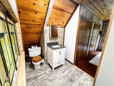 Discover this updated cabin retreat steps from golfing, fishing on El Valle Escondido Golf Course in New Mexico - for sale on GolfHomes.com, golf home, golf lot