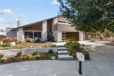 Discover this exceptional pool home located on a tree-lined on Vista Valencia Golf Course in California - for sale on GolfHomes.com, golf home, golf lot