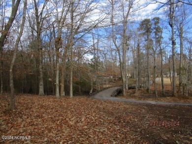 This lot is located in Albemarle Plantation at the 5th green and on Sound Golf Links at Albemarle Plantation in North Carolina - for sale on GolfHomes.com, golf home, golf lot