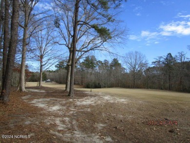 This lot is located in Albemarle Plantation at the 5th green and on Sound Golf Links at Albemarle Plantation in North Carolina - for sale on GolfHomes.com, golf home, golf lot