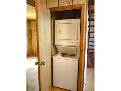 Discover this updated cabin retreat steps from golfing, fishing on El Valle Escondido Golf Course in New Mexico - for sale on GolfHomes.com, golf home, golf lot