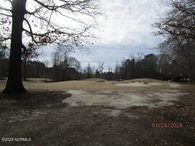 This lot is located in Albemarle Plantation at the 5th green and on Sound Golf Links at Albemarle Plantation in North Carolina - for sale on GolfHomes.com, golf home, golf lot