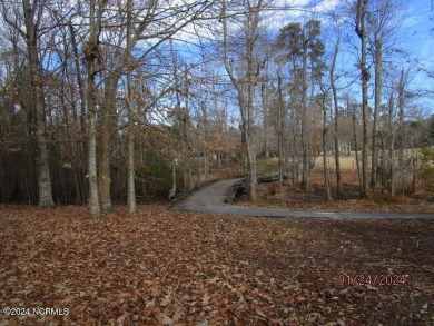 This lot is located in Albemarle Plantation at the 5th green and on Sound Golf Links at Albemarle Plantation in North Carolina - for sale on GolfHomes.com, golf home, golf lot