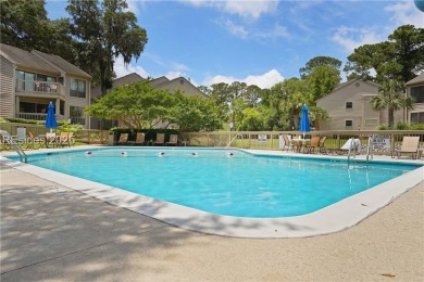 Updated and fully furnished top-floor corner unit in Lighthouse on Harbour Town Golf Links in South Carolina - for sale on GolfHomes.com, golf home, golf lot