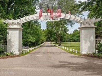 Classic Grand Beach Home that offers LOTS of OPTIONS!  This on Grand Beach Municipal Golf Course in Michigan - for sale on GolfHomes.com, golf home, golf lot