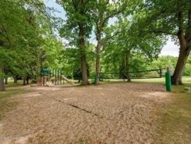 Classic Grand Beach Home that offers LOTS of OPTIONS!  This on Grand Beach Municipal Golf Course in Michigan - for sale on GolfHomes.com, golf home, golf lot