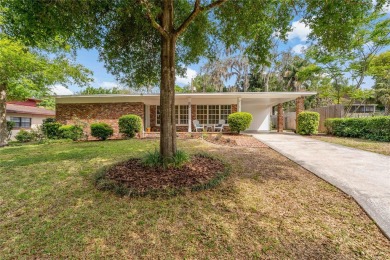 Nestled on a tree-lined street in the golf cart-friendly on Temple Terrace Golf and Country Club in Florida - for sale on GolfHomes.com, golf home, golf lot