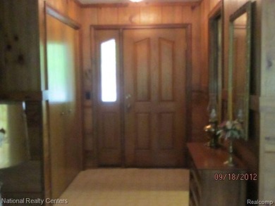 Welcome to 4010 Owl. This custom built Mahalak contemporary on Lost Lake Woods Club in Michigan - for sale on GolfHomes.com, golf home, golf lot
