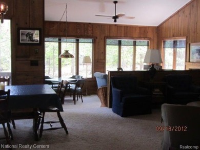 Welcome to 4010 Owl. This custom built Mahalak contemporary on Lost Lake Woods Club in Michigan - for sale on GolfHomes.com, golf home, golf lot